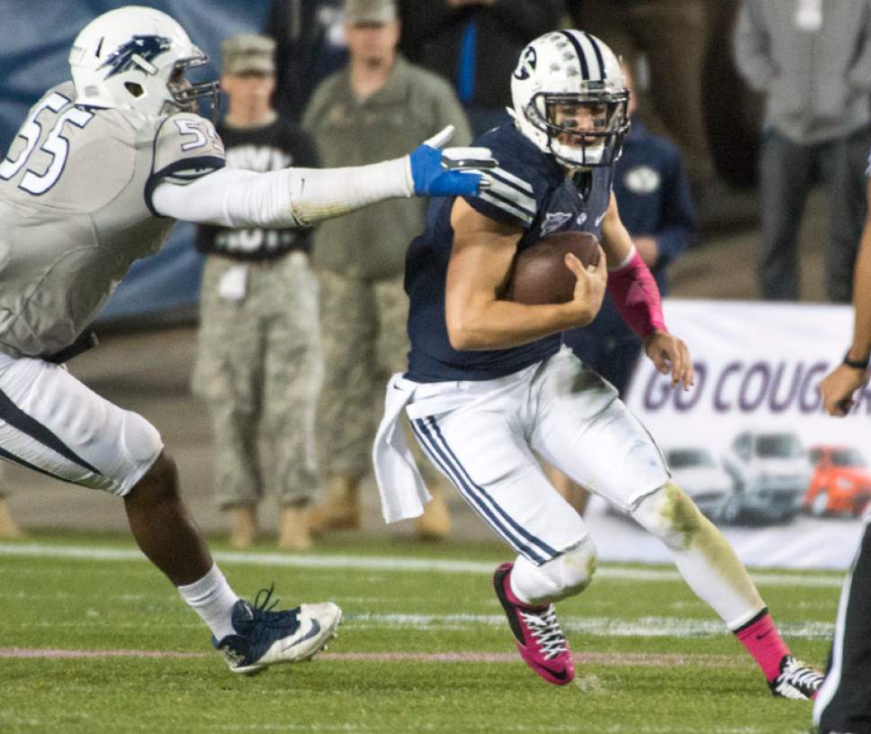 Rick Egan  |  The Salt Lake Tribune

Brigham Young Cougars quarterback Christian Stewart (7) runs for a first down on a quarterback keeper, in fourth quarter action, BYU vs The Nevada Wolf Pack at Lavell Edwards Stadium, Saturday, October18, 2014