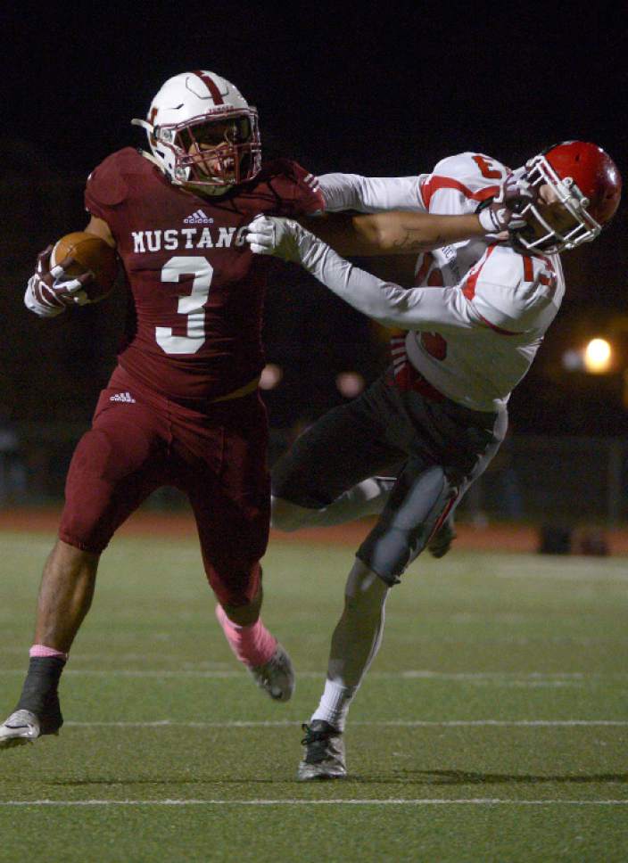 Leah Hogsten  |  The Salt Lake Tribune
 Herriman's Noah Vaea strong-arms American Fork's Justin Harmon. Herriman High School defeated American Fork High School 30-10 during their Region 4 football game, October 7, 2016 in Herriman.