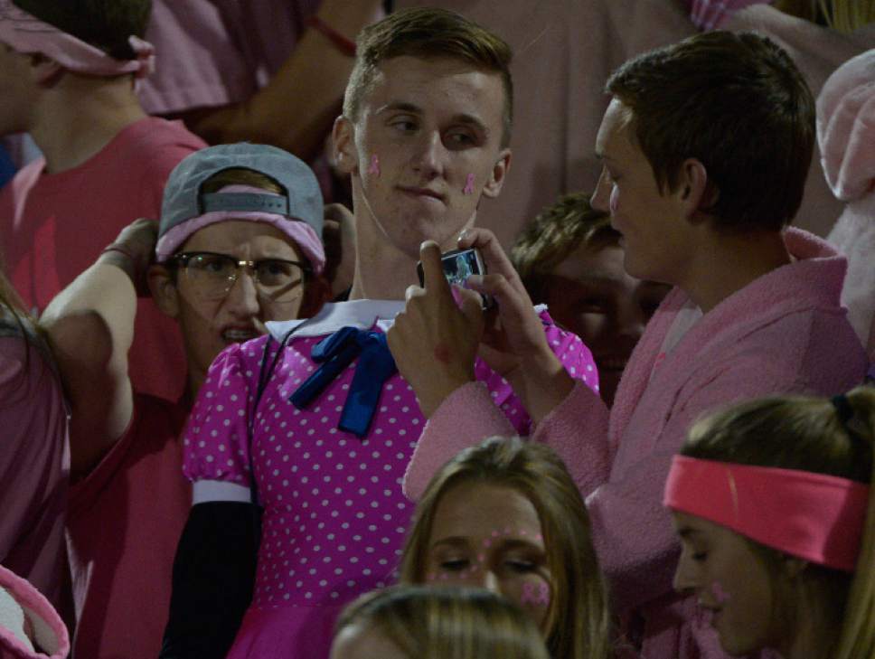 Leah Hogsten  |  The Salt Lake Tribune
Herriman fans wear pink in honor of Breast Cancer Awareness Month.  Herriman High School defeated American Fork High School 30-10 during their Region 4 football game, October 7, 2016 in Herriman.