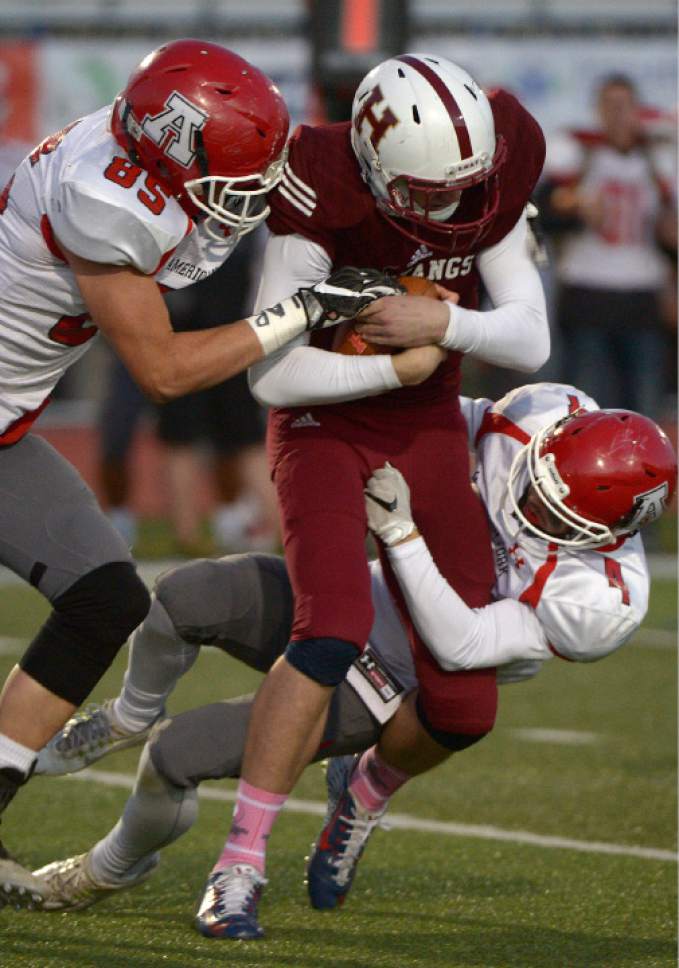 Leah Hogsten  |  The Salt Lake Tribune
American Fork's Davis Rasmusson and AJ Jaecke sack Herriman quarterback Blake Freeland. Herriman High School leads American Fork High School 16-0 at the half during their Region 4 football game,  October 7, 2016 in Herriman.