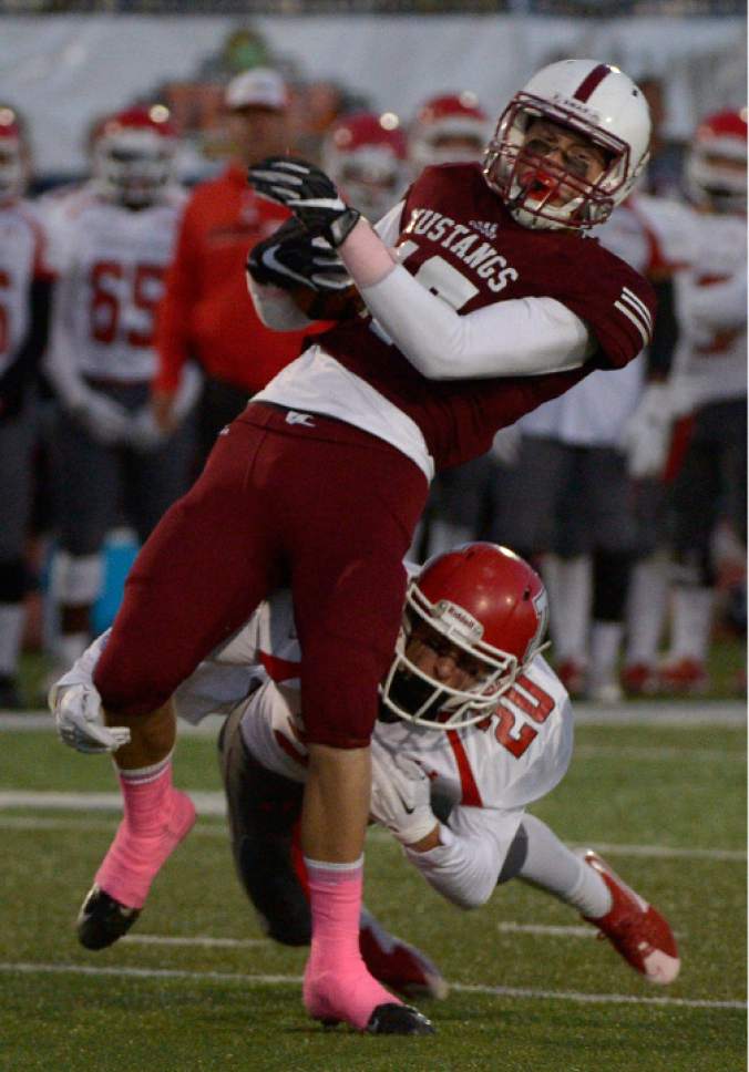 Leah Hogsten  |  The Salt Lake Tribune
Herriman's Jaden Cutler is brought down by American Fork's Brody Anderson. Herriman High School leads American Fork High School 16-0 at the half during their Region 4 football game,  October 7, 2016 in Herriman.