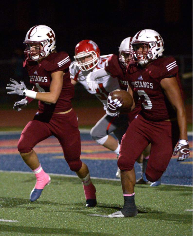 Leah Hogsten  |  The Salt Lake Tribune
 Herriman's Noah Vaea pulls down an interception in the 2nd period. Herriman High School leads American Fork High School 16-0 at the half during their Region 4 football game,  October 7, 2016 in Herriman.