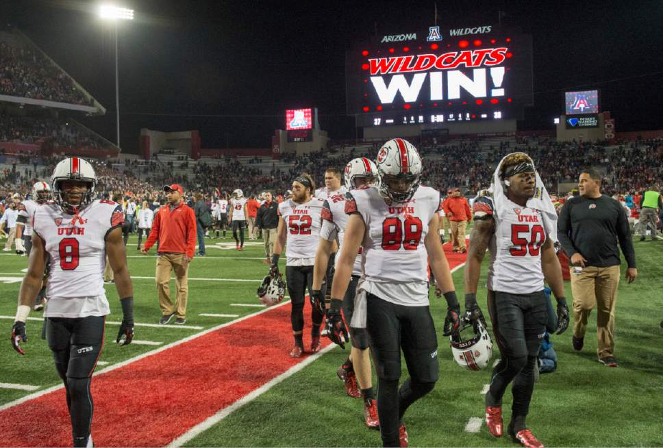 Rick Egan  |  The Salt Lake Tribune

The Utah Utes leave the field as the Wildcats celebrate their 37-30 win over the Utes in double overtime, in PAC-12 action against the Arizona Wildcats, in Tucson, Saturday, November 14, 2015.