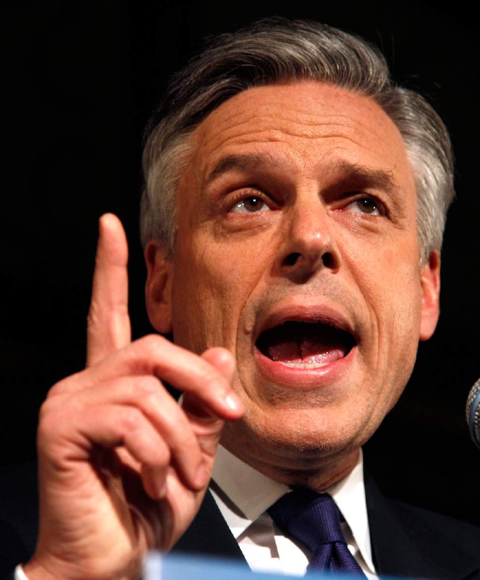 Republican presidential candidate, former Utah Gov. Jon Huntsman gestures during a New Hampshire primary night party in Manchester, N.H., Tuesday Jan. 10, 2012. (AP Photo/Charles Krupa)