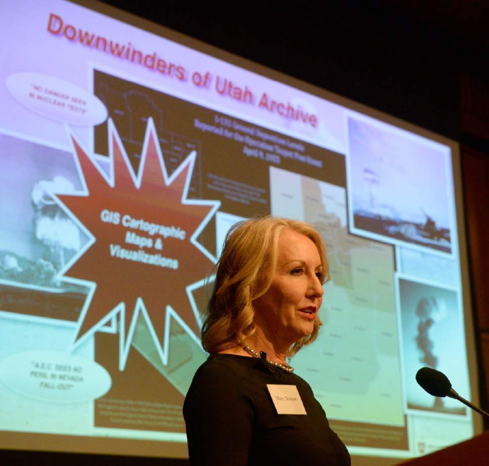 In a Monday, Oct. 3, 2016 photo, playwright Mary Dickson, whose 2007 play "Exposed" chronicled the effects the above ground nuclear tests had on the downwind population in Utah, speaks at launch event for "Downwinders of Utah Archive" at the J. Willard Marriott Library at the University of Utah in Salt Lake City. The new University of Utah archive about the state's "downwinders" features oral histories, photographs and newspapers clippings documenting the impact of nuclear testing during the 1950s in Nevada. (Al Hartmann /The Salt Lake Tribune via AP)