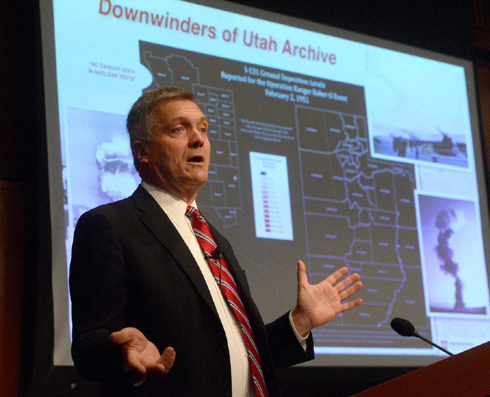 In this Monday, Oct. 3, 2016 photo,  former Utah Congressman Jim Matheson, an advocate for compensation for the downwind population in Utah affected by cancer speaks at the launch event for "Downwinders of Utah Archive" at the J. Willard Marriott Libray at the University of Utah in Salt Lake City. The new University of Utah archive about the state's "downwinders" features oral histories, photographs and newspapers clippings documenting the impact of nuclear testing during the 1950s in Nevada.  (Al Hartmann /The Salt Lake Tribune via AP)