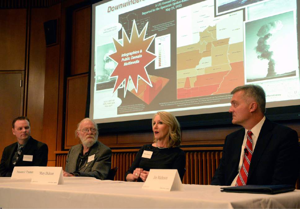 In this Monday, Oct. 3, 2016 photo, panelists Justin Sorenson, archive creator, left, Preston Truman, lifelong downwinder activist, playwright Mary Dickson and former Utah congressman Jim Matheson speak at the launch event for "Downwinders of Utah Archive" at the J. Willard Marriott Libray at the University of Utah  in Salt Lake City. The new University of Utah archive about the state's "downwinders" features oral histories, photographs and newspapers clippings documenting the impact of nuclear testing during the 1950s in Nevada. (Al Hartmann /The Salt Lake Tribune via AP)