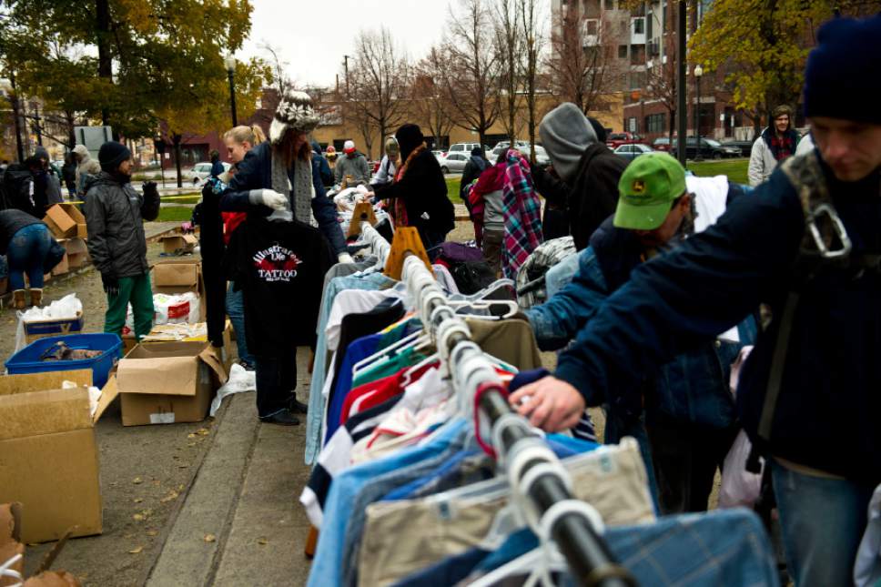 Chris Detrick  |  The Salt Lake Tribune
People look at free clothes available for free during The Legacy Initiative Homeless Outreach and Street Boutique at Pioneer Park in Salt Lake City Saturday November 16, 2013.