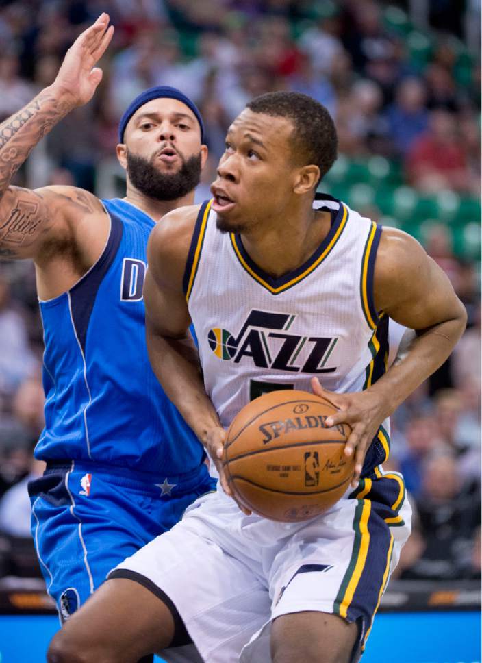 Lennie Mahler  |  The Salt Lake Tribune

Rodney Hood tries to score past Deron Williams during the home season closer against the Dallas Mavericks on Monday, April 11, 2016, at Vivint Smart Home Arena.