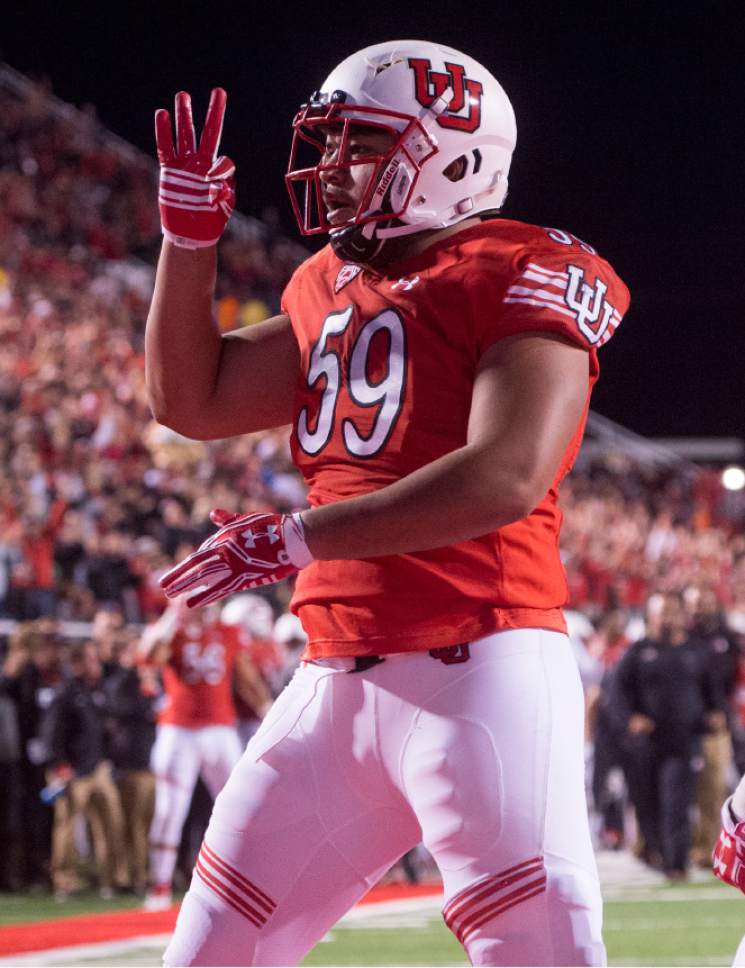 Rick Egan  |  The Salt Lake Tribune

Utah Utes defensive tackle Pasoni Tasini (59) celebrates after tackling Wildcats quarterback Brandon Dawkins (13) in the end zone for a safety, in PAC-12 football action, Utah vs. The Arizona Wildcats, at Rice-Eccles Stadium, Saturday, October 8, 2016.