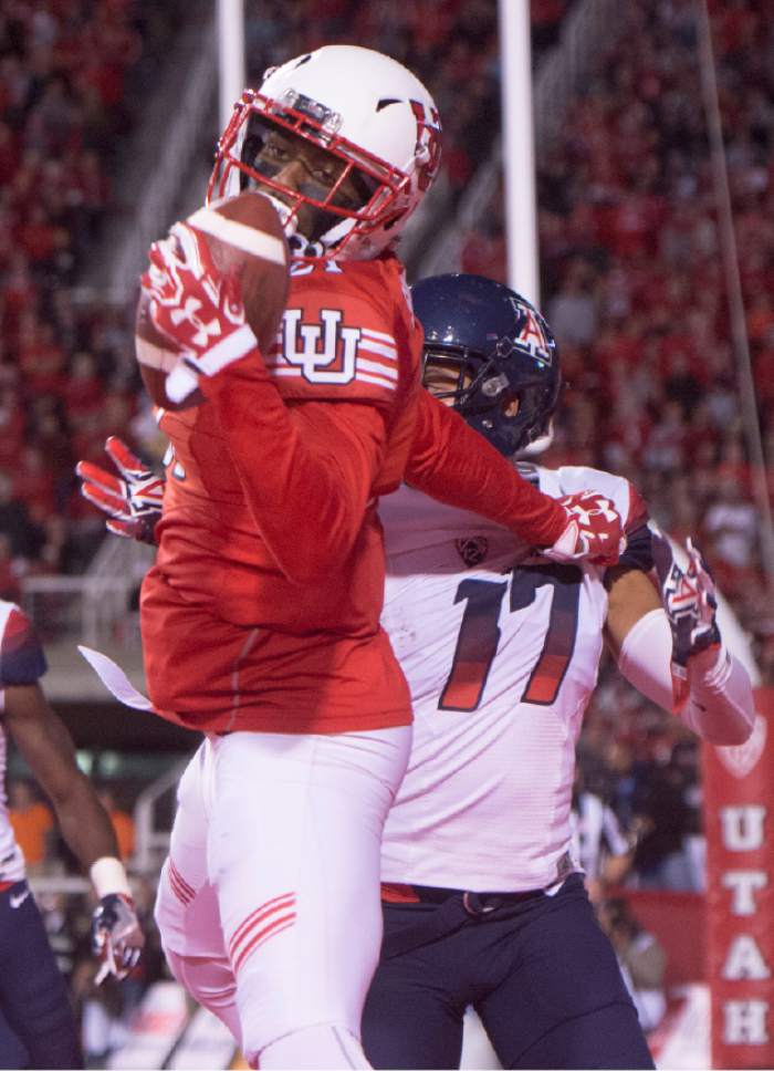 Rick Egan  |  The Salt Lake Tribune

Utah Utes wide receiver Tyrone Smith (21) holds on the to ball after making a one-handed catch for a Utah touchdown, as Arizona cornerback Jace Whittaker (17) defends, in PAC-12 football action, Utah vs. The Arizona Wildcats, at Rice-Eccles Stadium, Saturday, October 8, 2016.