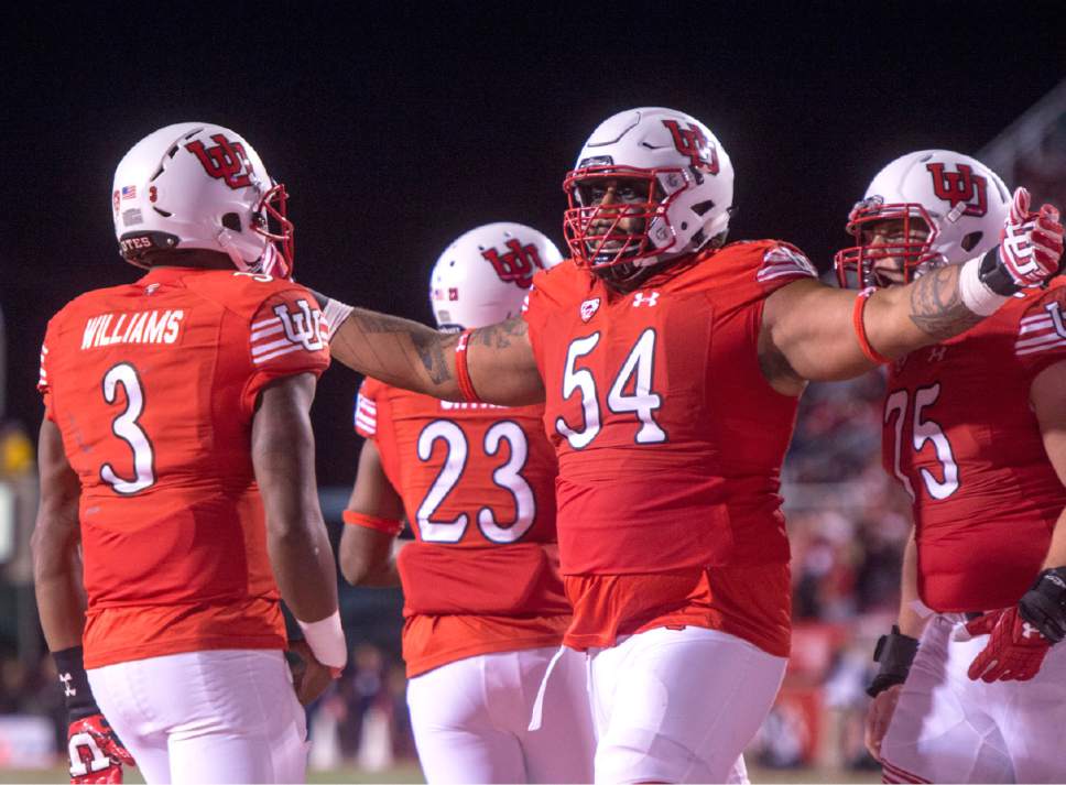 Rick Egan  |  The Salt Lake Tribune

Utah Utes offensive lineman Isaac Asiata (54) celebrates after Utah quarterback Troy Williams (3) scored touchdown for the Utes, in PAC-12 football action, Utah vs. The Arizona Wildcats, at Rice-Eccles Stadium, Saturday, October 8, 2016.