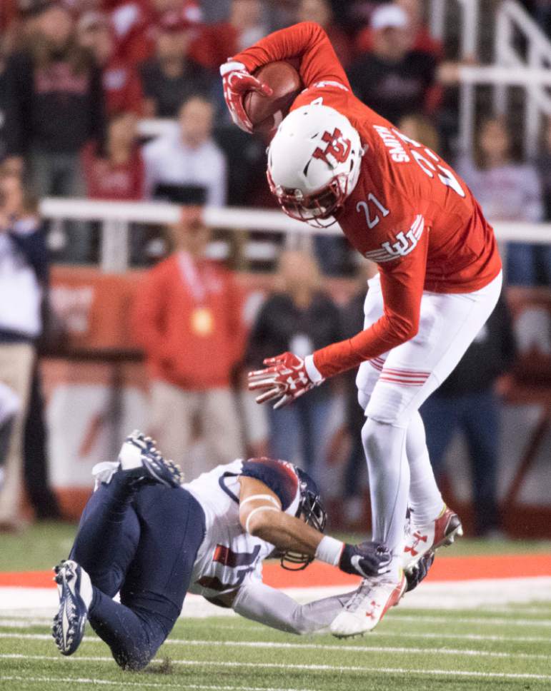 Rick Egan  |  The Salt Lake Tribune

Arizona Wildcats linebacker Michael Barton (11) brings down, Utah Utes wide receiver Tyrone Smith (21), in PAC-12 football action, Utah vs. The Arizona Wildcats, at Rice-Eccles Stadium, Saturday, October 8, 2016.