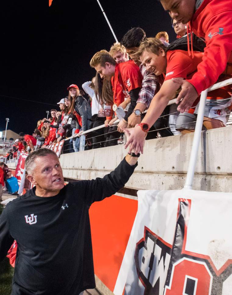 Rick Egan  |  The Salt Lake Tribune

Utah Utes head coach Kyle Whittingham high-fives fans after his 100th win, in PAC-12 football action, Utah vs. The Arizona Wildcats, at Rice-Eccles Stadium, Saturday, October 8, 2016.