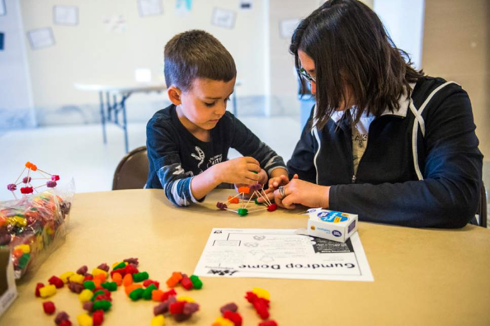 Chris Detrick  |  The Salt Lake Tribune
Virgil, 4, and Jolene Andrews, of Denver, Colo., construct a geodesic dome out of tooth picks and gum drops during the Capitol Centennial Discovery Day at the Utah State Capitol Saturday October 8, 2016.