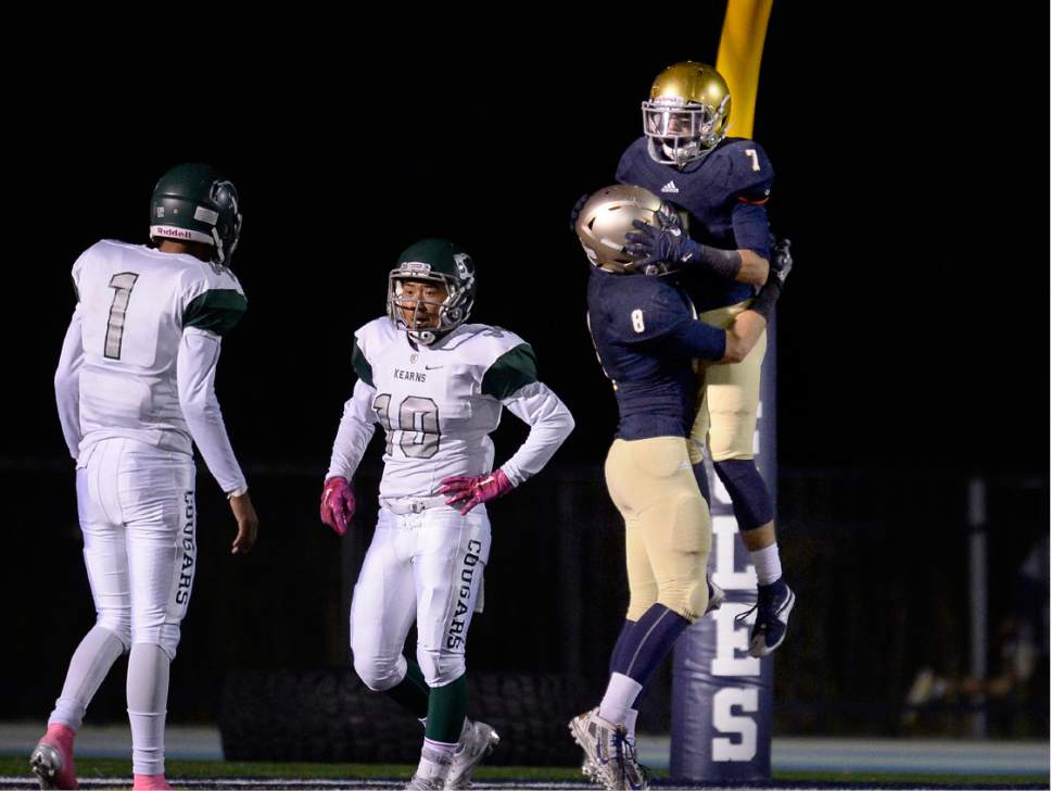 Scott Sommerdorf   |  The Salt Lake Tribune  
Kearns DBs Jamil Thompson and Peter Do react as Skyline's Yioti Karahalios lifts up WR Ben Knight after Knight scored on a TD catch during first half play. Kearns led Skyline 23-14 at the half, Friday, October 7, 2016.