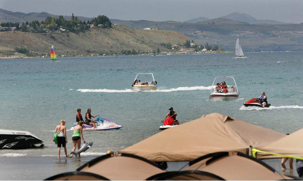Scott Sommerdorf  l  The Salt Lake Tribune

"A Day at the Bear Lake Beach." Boats, jetskis, and sailboats ply the waters off Rendezvous Beach State Park on south end of Bear Lake, Saturday, July, 3, 2010.