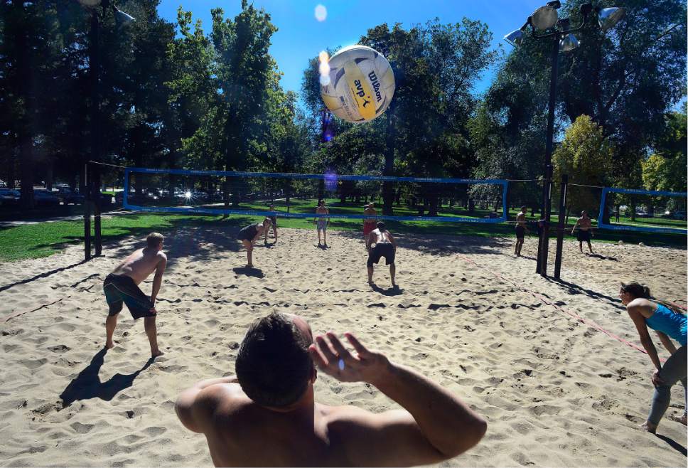 Scott Sommerdorf   |  The Salt Lake Tribune  
Players in the Sand Bar Volleyball League play matches in Liberty Park, Sunday, October 9, 2016, as they gear up for their championship games on October 30.