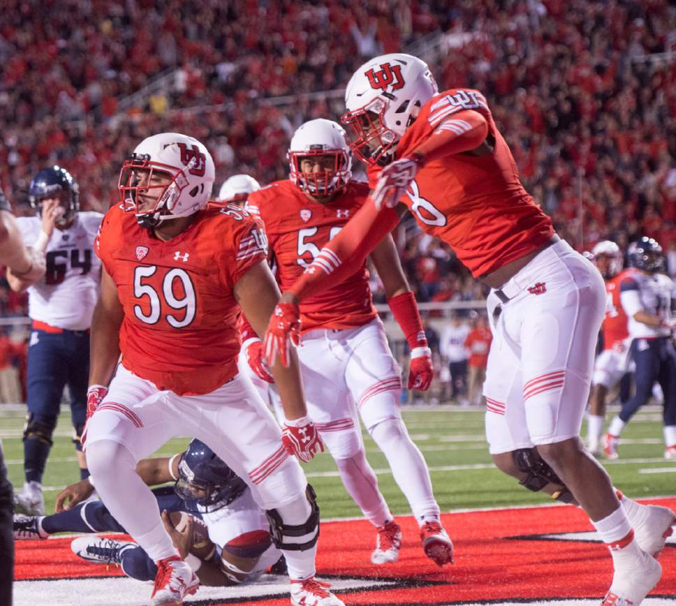 Rick Egan  |  The Salt Lake Tribune

Utah defensive tackle Pasoni Tasini (59) celebrates with his team mates after he sacked Wildcats quarterback Brandon Dawkins (13) in the end zone for a safety, in PAC-12 football action, Utah vs. The Arizona Wildcats, at Rice-Eccles Stadium, Saturday, October 8, 2016.