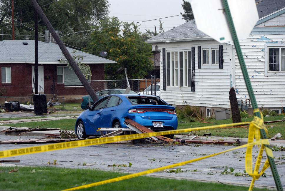 Al Hartmann  |  The Salt Lake Tribune
Utility workers survey the damage to electrical and gas lines in the area of 174 E. 4700 South Friday morning September 23 in South Ogden's Washington Terrace neighborhood.  Yesterday a small tornado touched down and damaged about a dozen structures.  Lt. Nate Hutchinson with the Weber County Sheriff's office said that the area would be under a hard closure to residents until the area is judge to be safe.