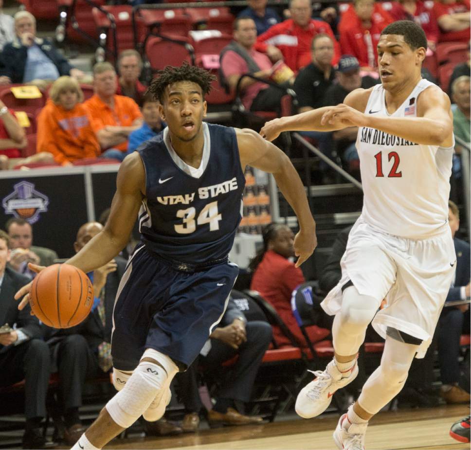 Rick Egan  |  The Salt Lake Tribune

San Diego State Aztecs forward Malik Pope (21) trails Utah State Aggies guard Chris Smith (34) as he goes to the hoop, in Mountain West Tournament action, The Utah State Aggies vs. San Diego State Aztecs, at the Thomas and Mack Center in Las Vegas, Thursday, March 10, 2016.