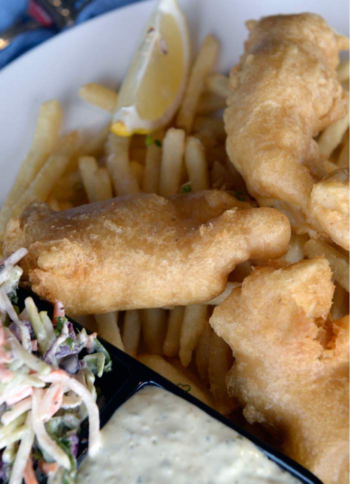 Al Hartmann  |  The Salt Lake Tribune
Halibut fish and chips, with french fries, slaw, with house tartar sauce, at the new Garage Grill & RPM Brewery at 1122 E. Draper Parkway in Draper.