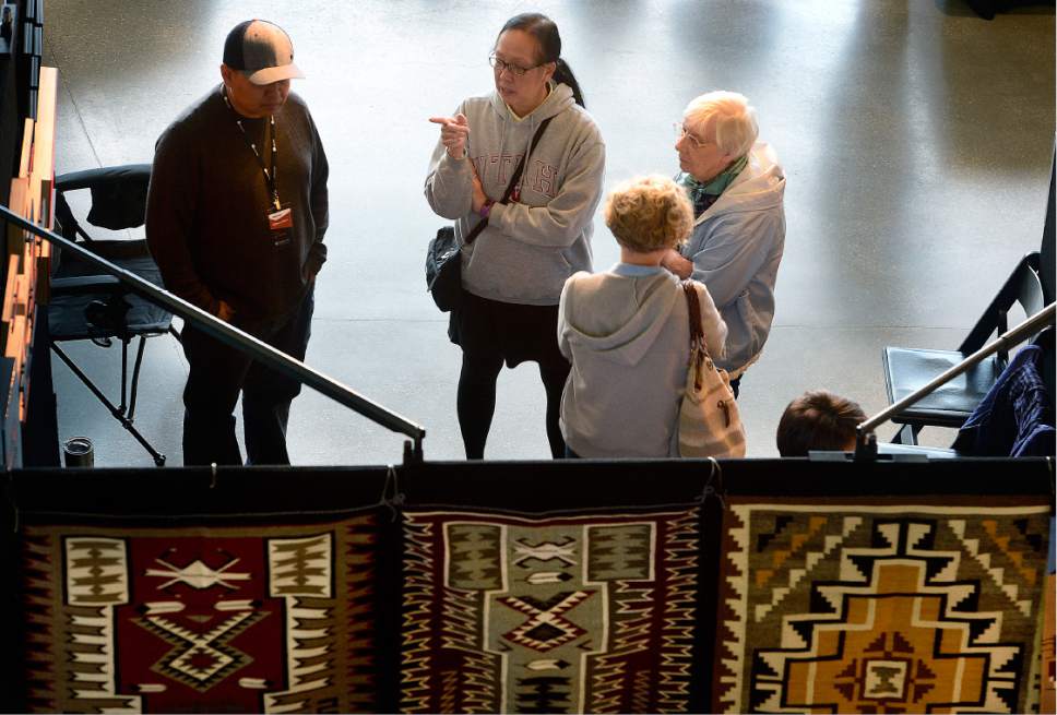 Scott Sommerdorf   |  The Salt Lake Tribune  
Visitors look at art on display at the Natural History Museum on Saturday, Oct. 8, 2016.