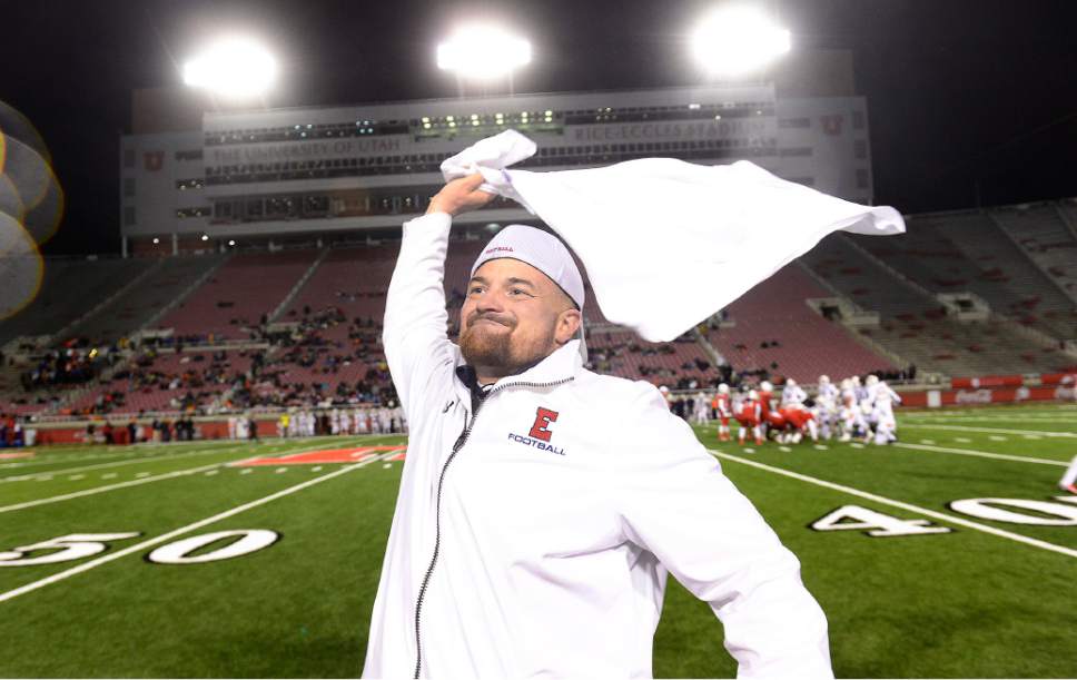 Scott Sommerdorf   |  The Salt Lake Tribune
East head coach Brandon Matich waves a towel as he celebrates his team's victory ion the 4A title game. East beat Timpview 49-14 for the Utah 4A championship, Friday, November 20, 2015.