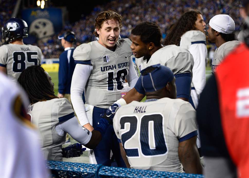 Scott Sommerdorf  |  The Salt Lake Tribune
Utah State Aggies quarterback Darell Garretson celebrates with team mates after a USU TD during first half play. Utah State led BYU 28-14 at the half in Provo, Friday, October 1, 2014.