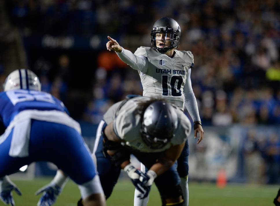 Scott Sommerdorf  |  The Salt Lake Tribune
Utah State Aggies quarterback Darell Garretson (10) shouts directions to his offensive line during first half play. Utah State led BYU 28-14 at the half in Provo, Friday, October 1, 2014.