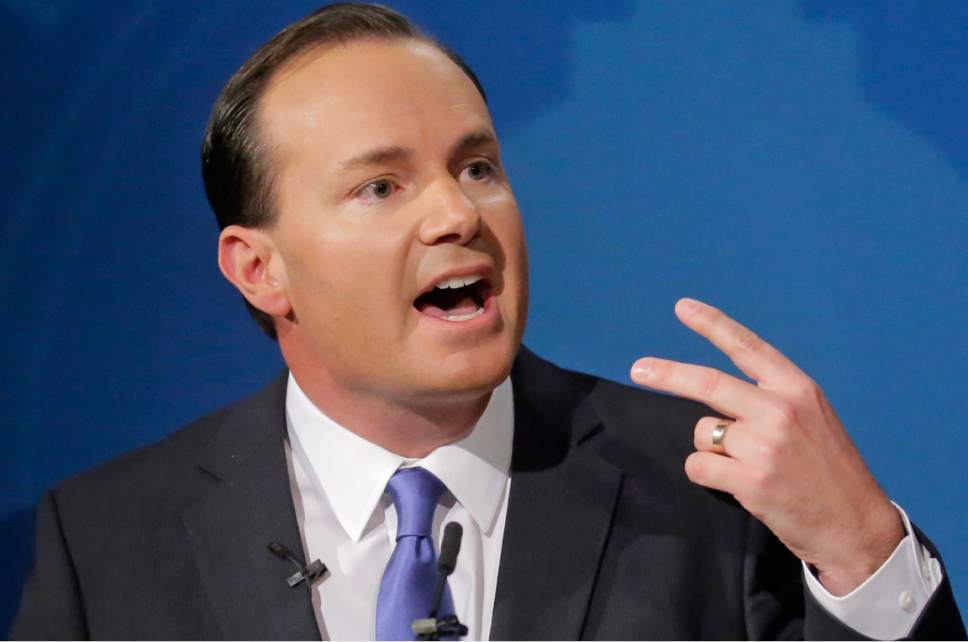 In this Wednesday, Oct. 12, 2016, photo, Republican Sen. Mike Lee, speaks with reporters after squaring off in a debate with Democratic challenger Misty Snow at Brigham Young University, in Provo, Utah. Lee is canceling his campaign events in Utah to instead campaign for other Republican senate candidates in Nevada, Colorado, and other states. The Salt Lake Tribune reports Lee's political director Marcus Jessop announced Wednesday that Lee is instead planning to hit the campaign trail to help Republicans try to keep control of the U.S. Senate. (AP Photo/Rick Bowmer, Pool)