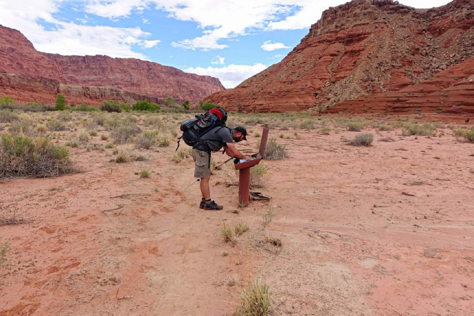Lennie Mahler  |  The Salt Lake Tribune

Peter Wagner signs a log book after hiking nearly 50 miles through Paria Canyon. Wednesday, Sept. 28, 2016.