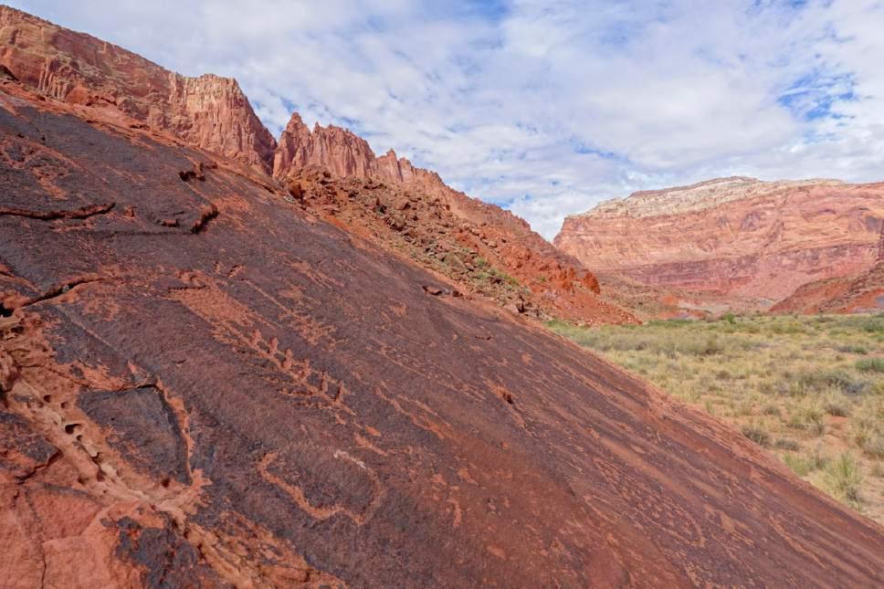 Lennie Mahler  |  The Salt Lake Tribune

American Indian petroglyphs reveal themselves on flat boulders along the Paria River on Wednesday, Sept. 28, 2016.