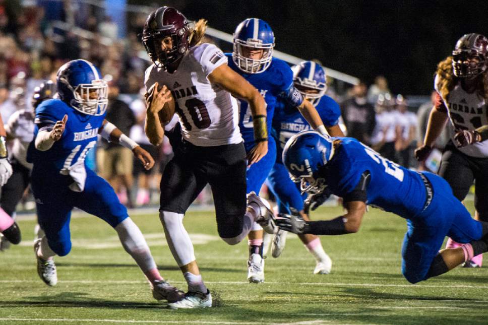 Chris Detrick  |  The Salt Lake Tribune
Jordan's Crew Wakley (10) scores a touchdown past Bingham's Tongi Langi (10) and Bingham's Daniel Loua (20) during the game at Bingham High School Thursday October 13, 2016.