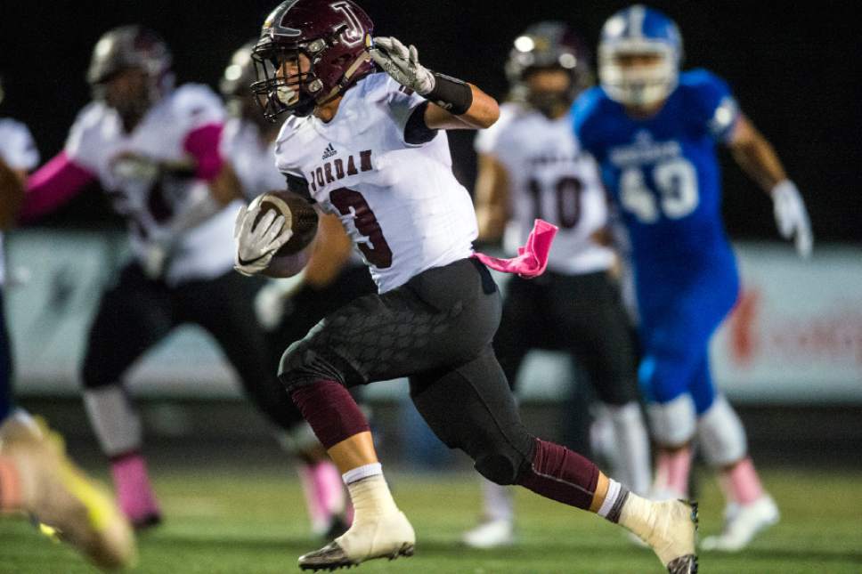 Chris Detrick  |  The Salt Lake Tribune
Jordan's Jake Shaver (3) runs the ball during the game at Bingham High School Thursday October 13, 2016.