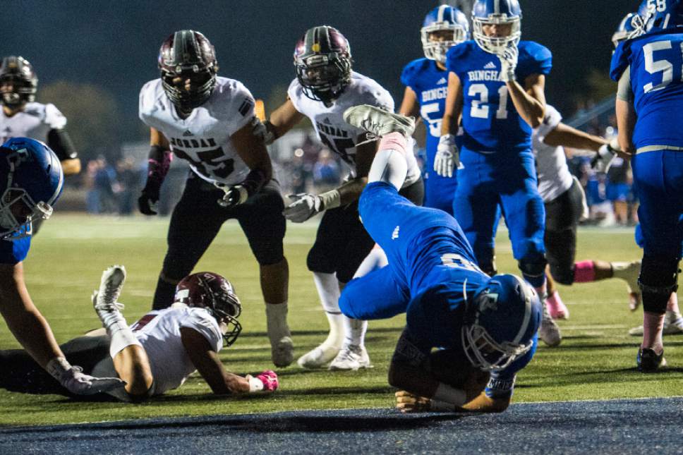 Chris Detrick  |  The Salt Lake Tribune
Bingham's Tate Peterson (40) scores a touchdown past Jordan's Benjamin Reyes (7) during the game at Bingham High School Thursday October 13, 2016.