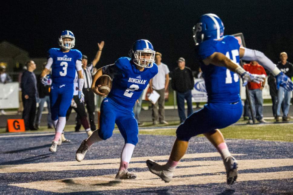 Chris Detrick  |  The Salt Lake Tribune
Bingham's Ryan Wood (2) celebrates his touchdown with Bingham's Dylan Devoogd (15) during the game at Bingham High School Thursday October 13, 2016.