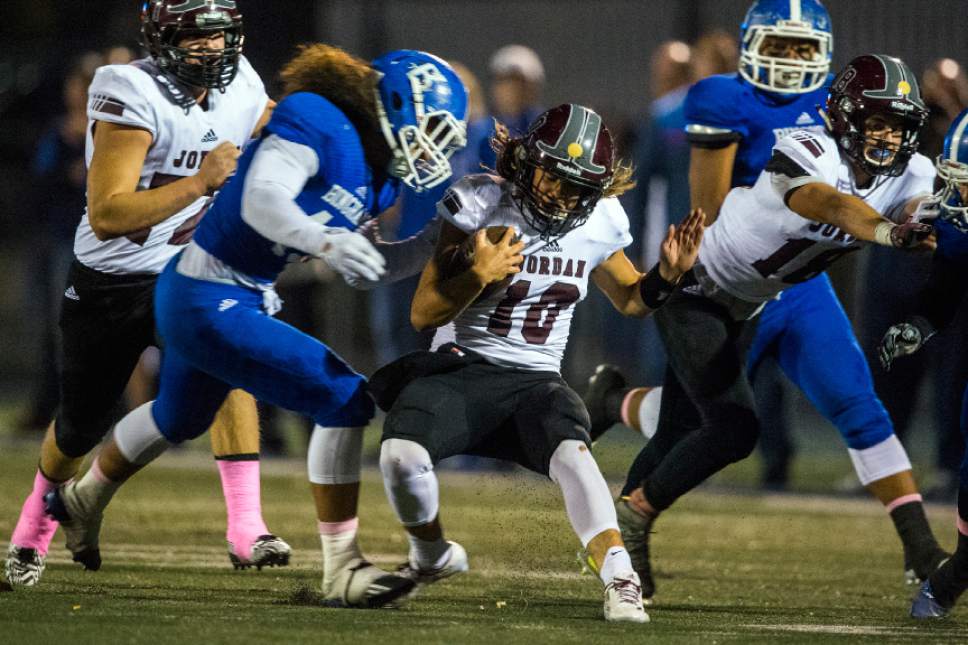 Chris Detrick  |  The Salt Lake Tribune
Bingham's Lolani Langi (43) tackles Jordan's Crew Wakley (10) during the game at Bingham High School Thursday October 13, 2016.