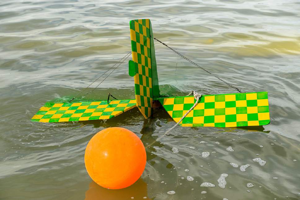 Trent Nelson  |  The Salt Lake Tribune
A buoy and anchor are attached to a fixed-wing plane in the Great Salt Lake where it crashed Thursday October 13, 2016.