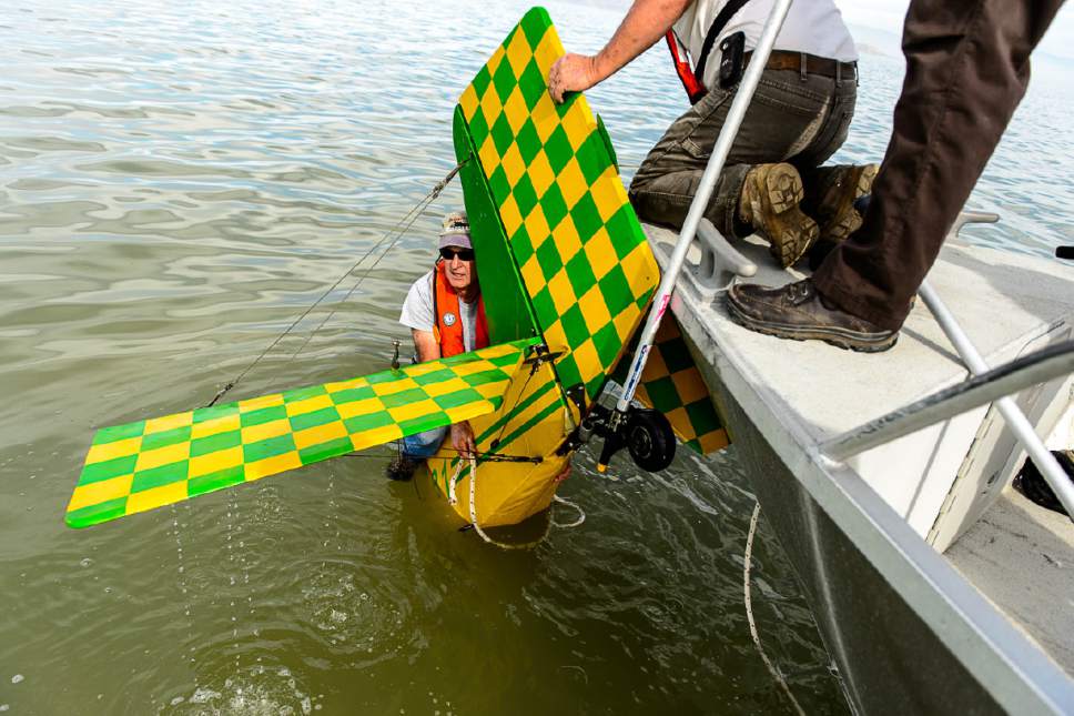Trent Nelson  |  The Salt Lake Tribune
Fred Austin of the Emergency Response Team for the Great Salt Lake work to attach an anchor and buoy to a fixed-wing plane sites the Great Salt Lake where it crashed Thursday October 13, 2016.