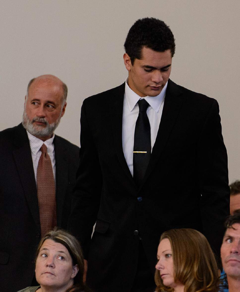 Trent Nelson  |  The Salt Lake Tribune
Osa Masina, the former Brighton High football star now charged with rape and other felonies related to a an alleged sexual assault over the summer leaves the courtroom in Salt Lake City on Friday.