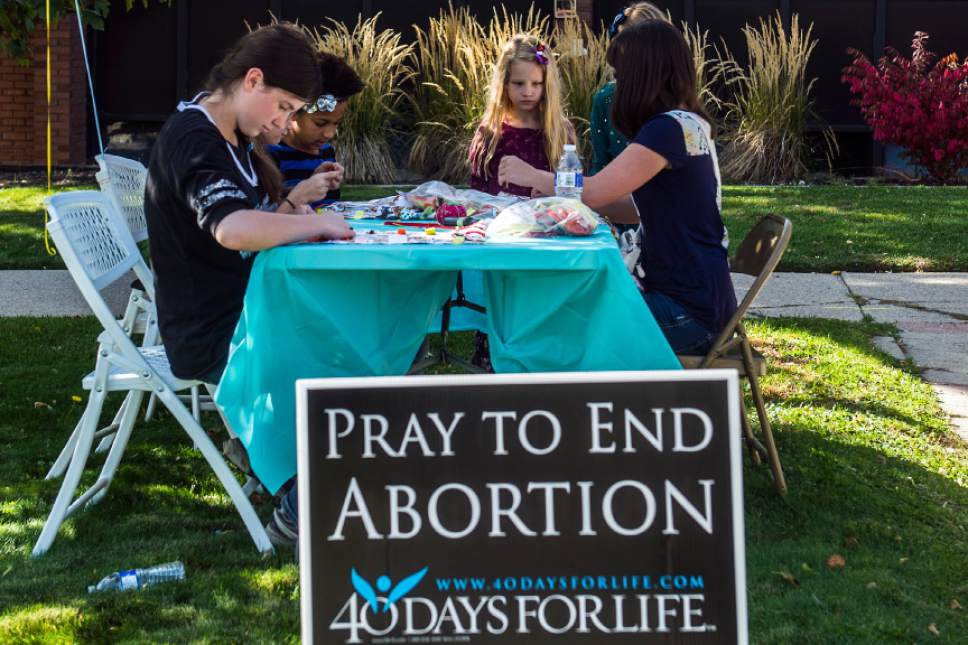 Chris Detrick  |  The Salt Lake Tribune
Volunteers work at putting together care packages during a ProLifeUtah Service Vigil protesting Planned Parenthood at the Metro Health Center in Salt Lake City on Saturday.