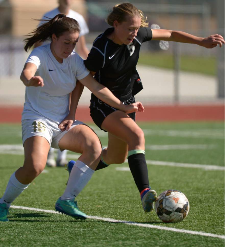 Leah Hogsten  |  The Salt Lake Tribune
Logan's Karly Lopez battles Stansbury's Maddy Graber. Logan High School girls soccer team defeated Stansbury High School 5-3 during their state 3A quarterfinals game at Logan, October 15, 2016.