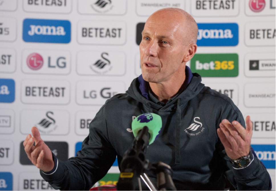 Bob Bradley the new team manager of English Premier League soccer team Swansea City speaks during a press conference at the Marriott Hotel, in Swansea, Wales Friday Oct. 7, 2016. Bradley is the first American to manage an English Premier League team. (Simon Galloway/PA via AP)