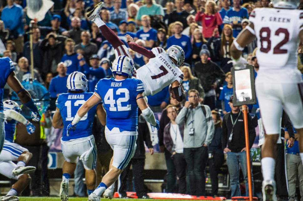 Chris Detrick  |  The Salt Lake Tribune
Mississippi State Bulldogs quarterback Nick Fitzgerald (7) dives into the end zone for a touchdown during the game at LaVell Edwards Stadium Friday October 14, 2016. Brigham Young Cougars defeated Mississippi State Bulldogs 28-21in double overtime.
