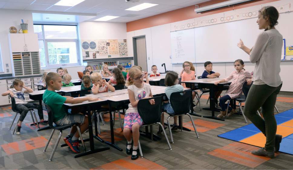 Al Hartmann  |  The Salt Lake Tribune
First year teacher Jane Hart goes over some basic rules for her first graders at the brand new Butler Elementary in Cotonwood Heights Wenesday March 25.  It is one of hundreds of schools that opened Wednesday as students gear up for the 2016-2017 school year.