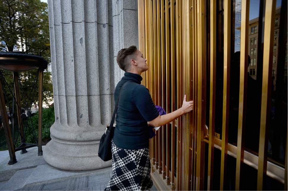 Scott Sommerdorf   |  The Salt Lake Tribune  
Debra Jenson of Ordain Women tries the doors of the LDS Church Administration Building and finds they are locked. The group had marched there to request a meeting with a general authority, Saturday, October 1, 2016.