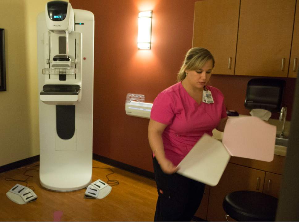 Leah Hogsten  |  The Salt Lake Tribune
l-r Mammography tech Autumn Mitchell prepares the  Genius 3D Hologic Mammography machine for a screening at the Breast Care Center at Davis Hospital, October 4, 2016. The Genius 3D Hologic Mammography machine provides 2D and 3D imaging. The 3D Mammography exams are a more advanced screening option than conventional 2D mammography, providing crisper, more contrasty images that are proven in clinical studies to detect cancer 15 months earlier than regular mammograms  and reduce unnecessary patient recalls.