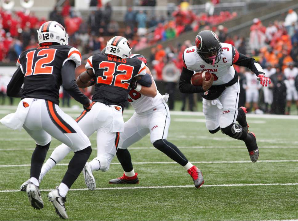 Utah quarterback Troy Williams (3) is tripped up as Oregon State's Kendal Hill (12) and Jonathan Willis (32) close in during the first half of an NCAA college football game in Corvallis, Ore., on Saturday, Oct. 15, 2016. (AP Photo/Timothy J. Gonzalez)