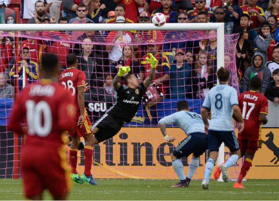Francisco Kjolseth | The Salt Lake Tribune
Real Salt Lake goalkeeper Nick Rimando (18) gets a hand in to block a shot in the final minutes of the game as Real Salt Lake hosts Sporting KC in MLS soccer at Rio Tinto Stadium in Sandy, Sunday, Oct. 16, 2016.